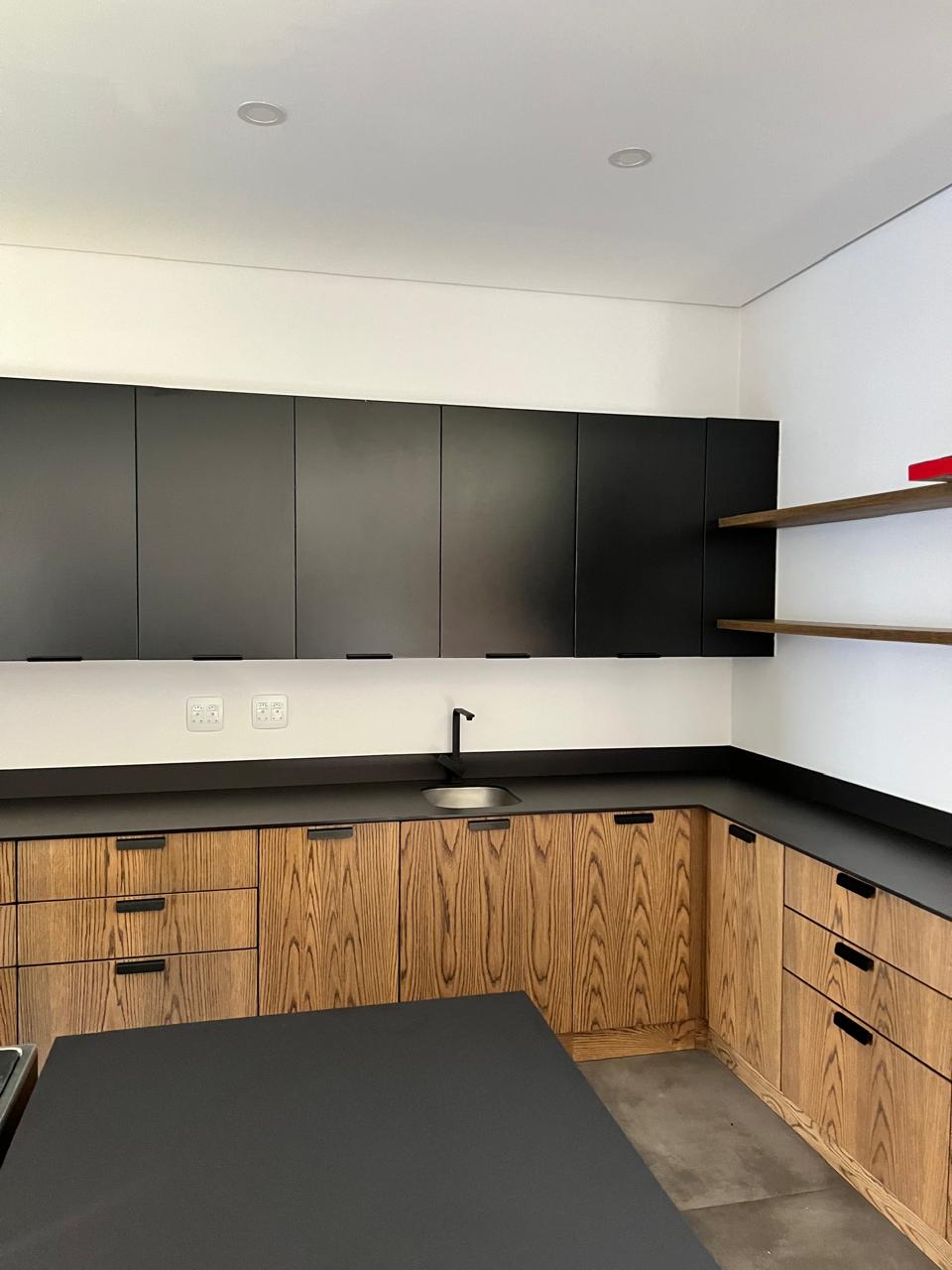 Modern kitchen with matte black and oak cabinetry &mdash; Luxury Home Renovation, Mazibuko Trading & Projects