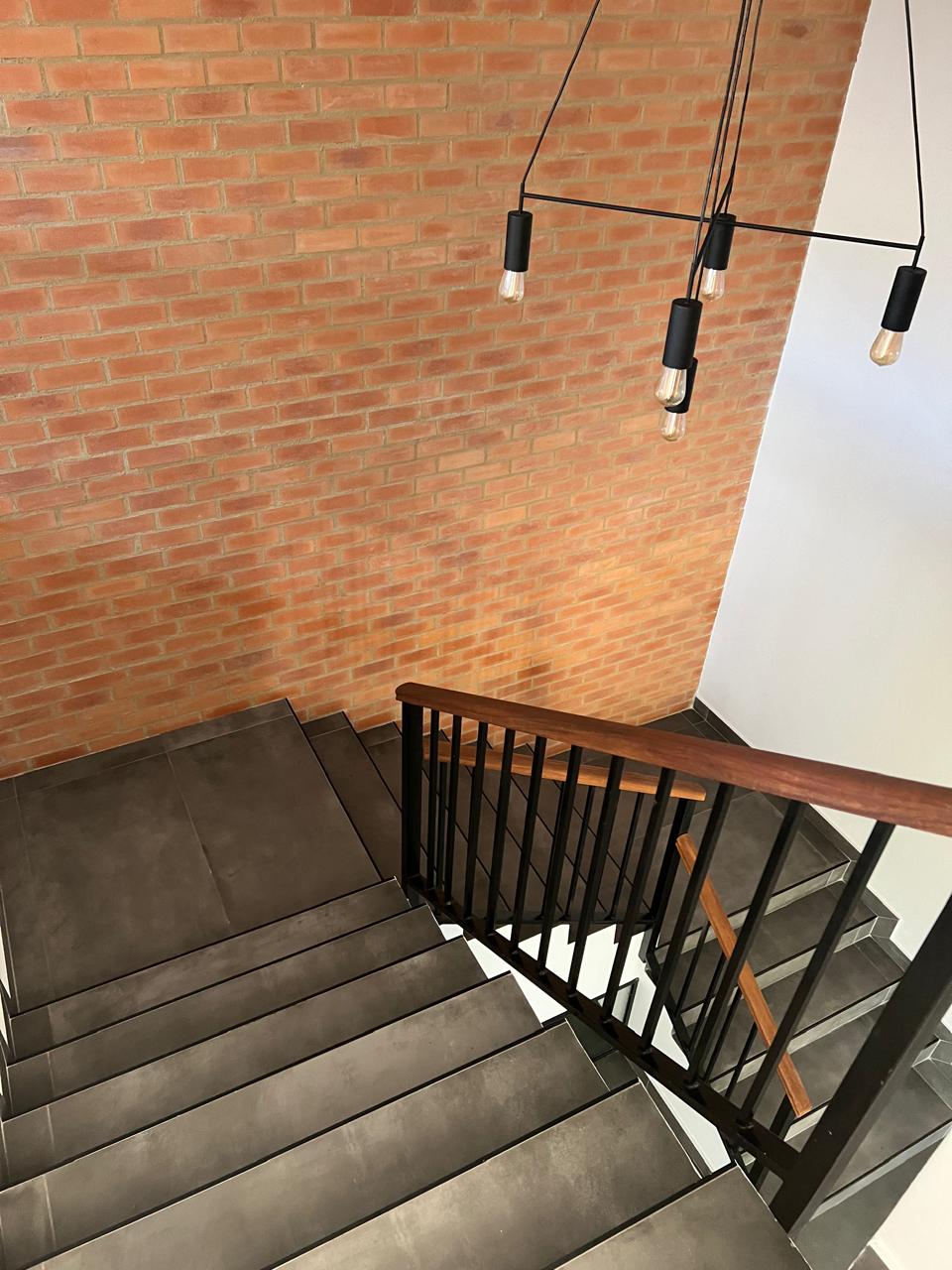 Staircase overlook with pendant lighting &mdash; Luxury Home Renovation, Mazibuko Trading & Projects