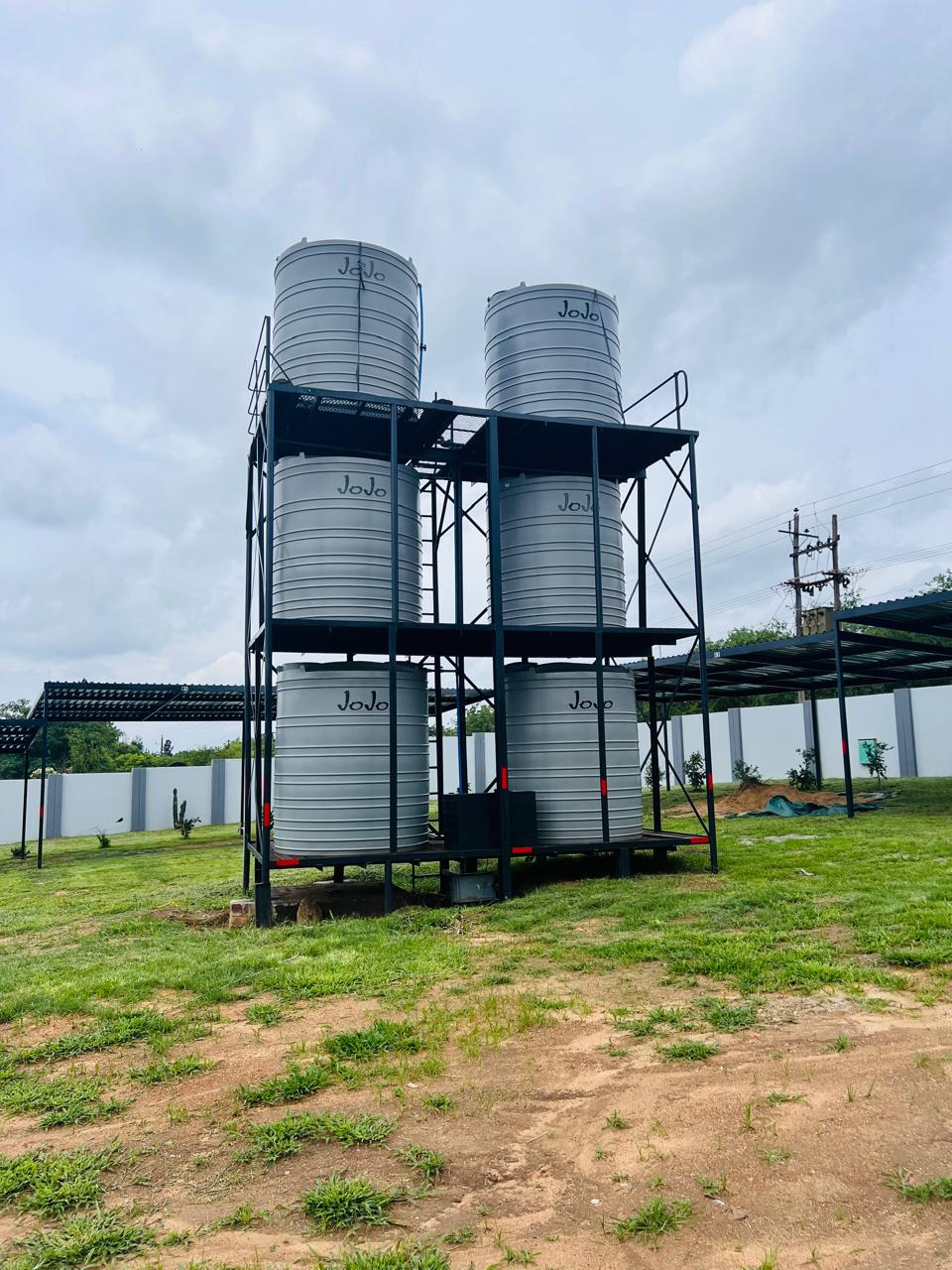 Elevated JoJo water tank installation &mdash; Multi-Unit Development Project, Mazibuko Trading & Projects