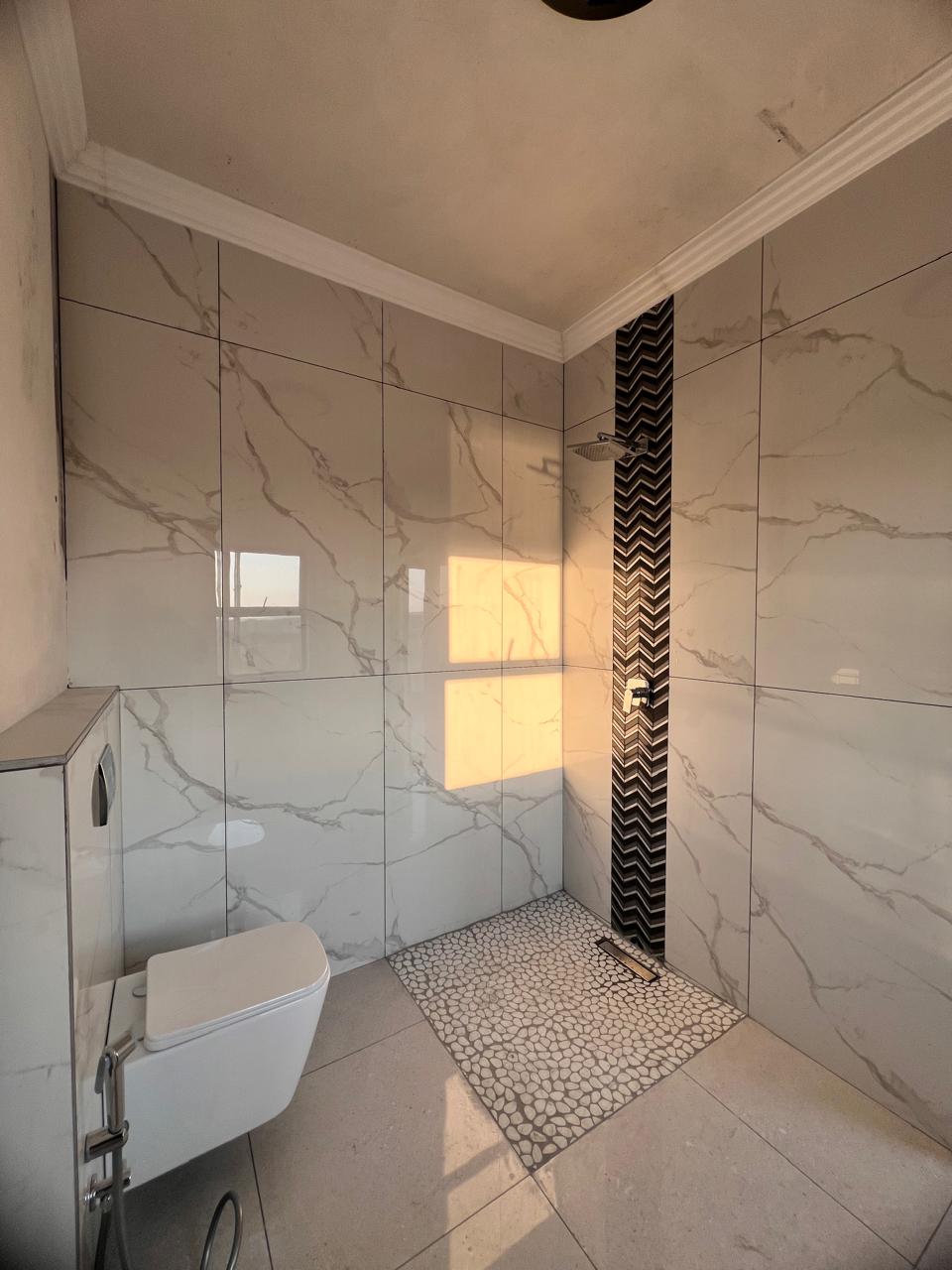 Finished bathroom with rain shower &mdash; Residential Renovation Project, Mazibuko Trading & Projects